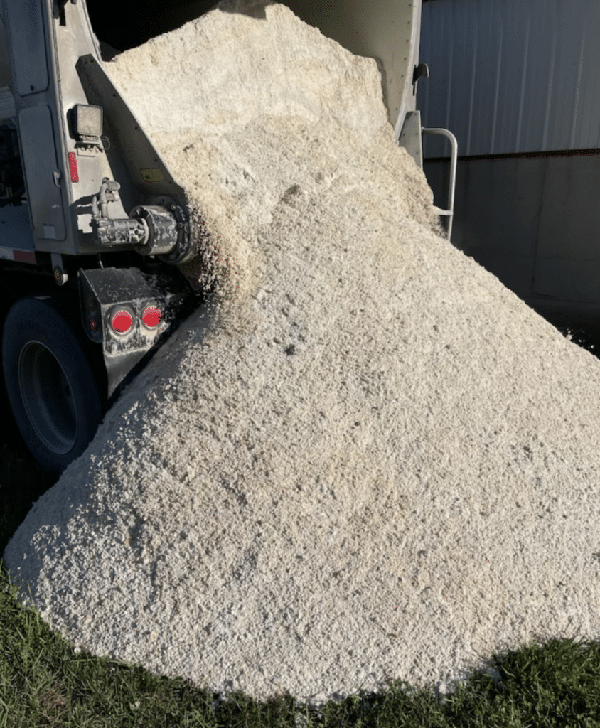 Photo shows truck dumping bulk egg shells, our OMRI listed organic lime product for organic farmers